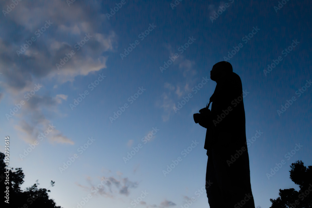 Silhouette of photographer shooting night stars, Man silhouette are taking photos with the evening sun, Action of man Silhouette of photographer shooting night stars, Man silhouette are taking photos with the evening sun, Action of man