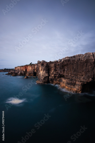 Panoramic view of cliff and sea in the Portuguese coastline. Long exposure