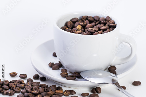 Coffee or espresso cup with coffee beans plain white background