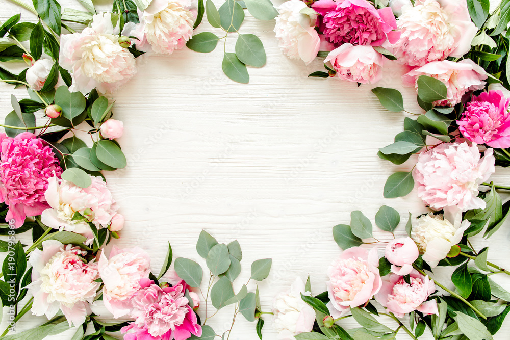 Floral pattern, frame made of beautiful pink peonies on wooden white background. Flat lay, top view. Valentine's background. Floral frame. Frame of flowers. Flowers texture Floral pattern, frame made of beautiful pink peonies on wooden white background. Flat lay, top view. Valentine's background. Floral frame. Frame of flowers. Flowers texture