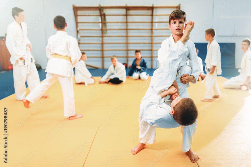 Boys in kimono fights, kid judo training