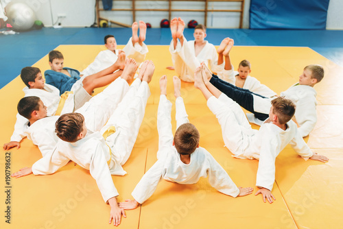 Boys in kimono training on the floor, kid judo © Nomad_Soul