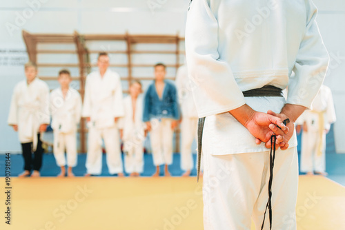 Trainer and little boys, kid judo training