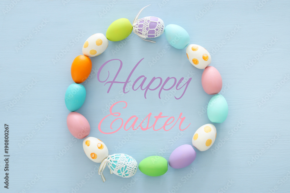 Top view of easter colorful eggs over blue background. Top view of easter colorful eggs over blue background.