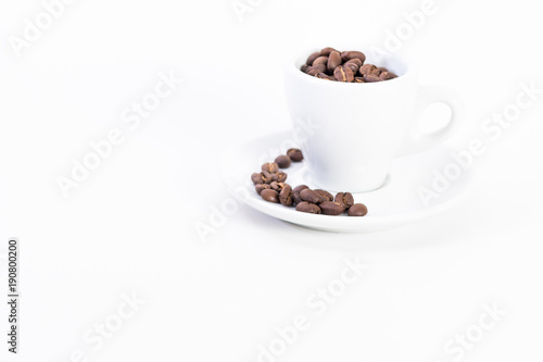 Coffee beans in a coffee or espresso cup next to a heart  Valentine s Day