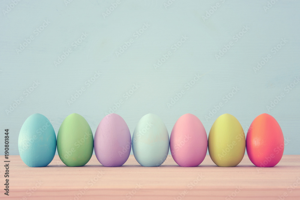 Top view of easter colorful eggs over blue background Top view of easter colorful eggs over blue background