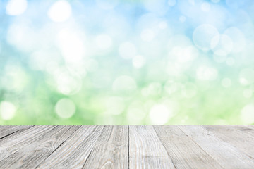 Wooden deck with blurred meadow background
