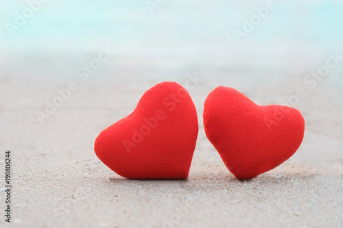 Beautiful of two red heart on the beach