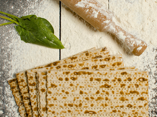 traditional Jewish kosher matzo for Easter pesah on a wooden table. Jewish Easter food. Spring.