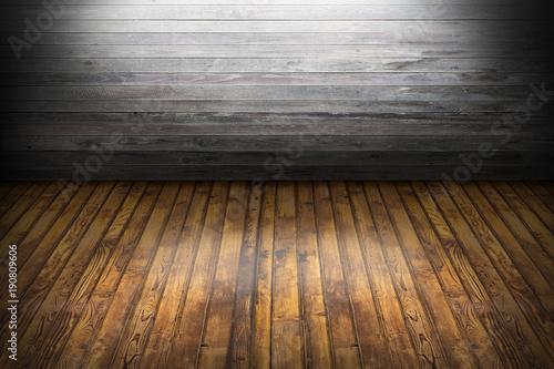 Empty gray wooden wall room interior with white light from top and shadows around and wooden brown flat floor perspectives. Designed for montage or your products display and text use on background