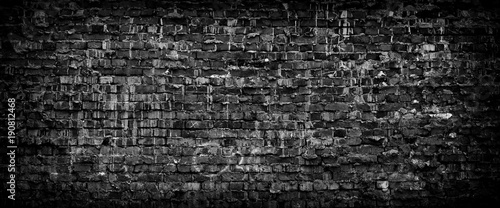 Foto Black grunge brick wall panoramic background.