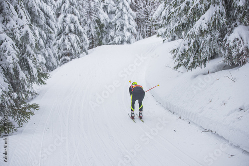 Professional nordic ski race, cross country competition, athlete in white winter nature. Original sport photo, winter game, South Korea 2018