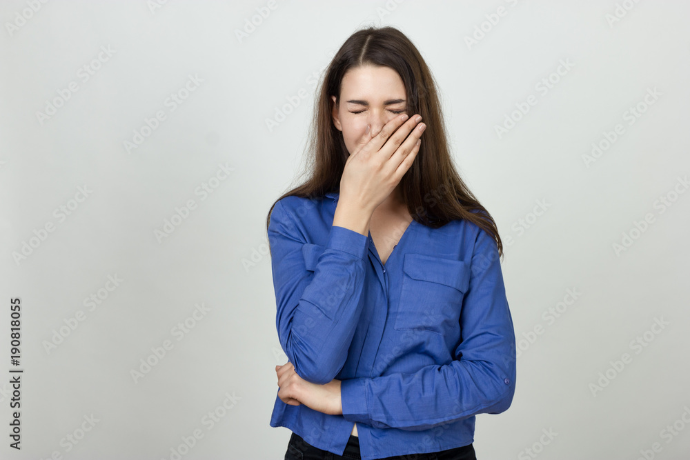 Woman holding her nose because of a bad smell Woman holding her nose because of a bad smell
