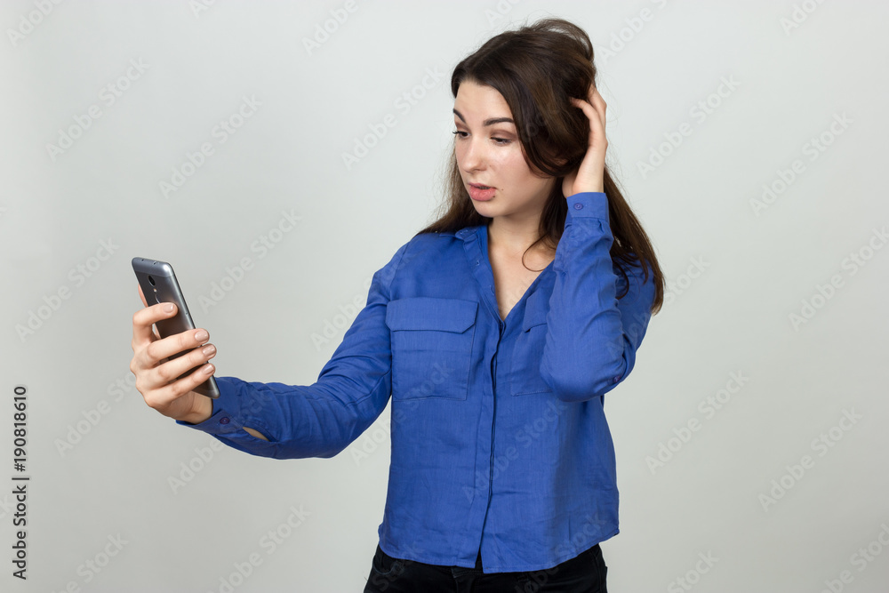Surprised woman using a cell phone Surprised woman using a cell phone
