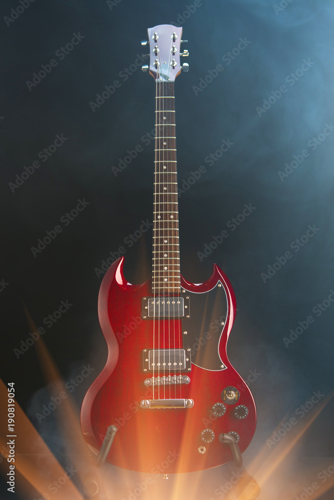 electric guitar in smoke with shiny glare