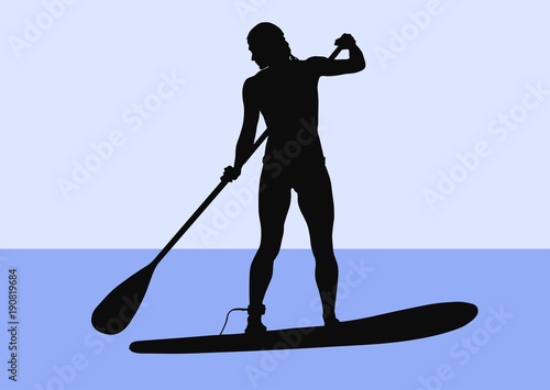 Silhouette of a female standup paddler