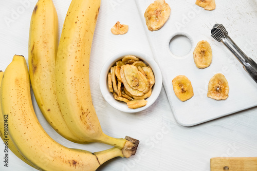 dried banana on white background.Homemade Dehydrated Banana Chips