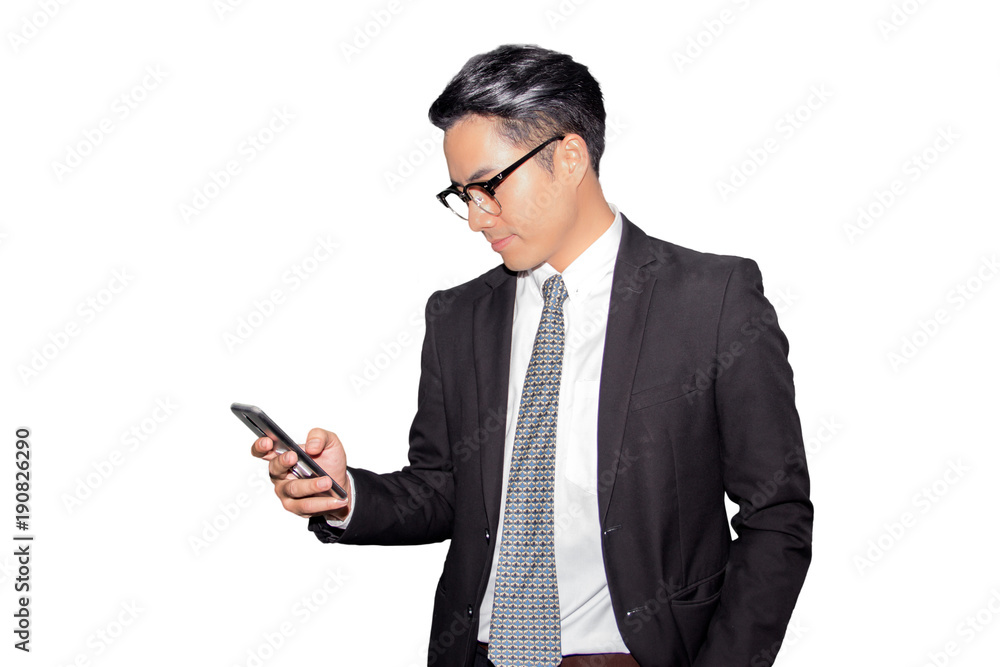 A handsome asian young businessman using smartphone on white background A handsome asian young businessman using smartphone on white background