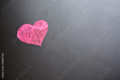 Drawing of heart on black.