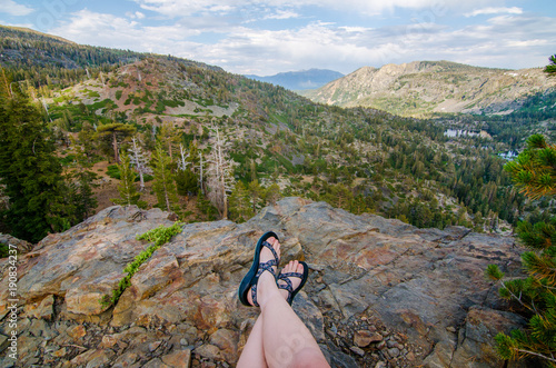 Tableau sur toile Girl Wearing Sandals Looking at the Mountains
