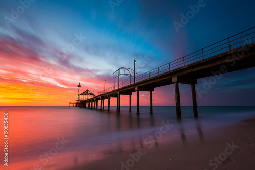 A vibrant sunset at Brighton Jetty in Brighton, Adelaide, South Australia, Australia on 1st February 2018 photo
