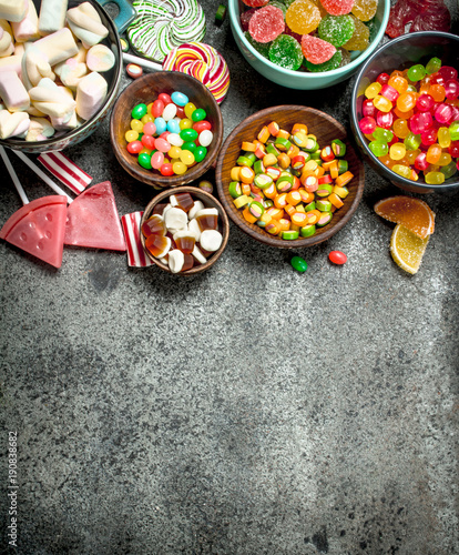 Multicolored candy, jelly and marshmallows in a bowl.