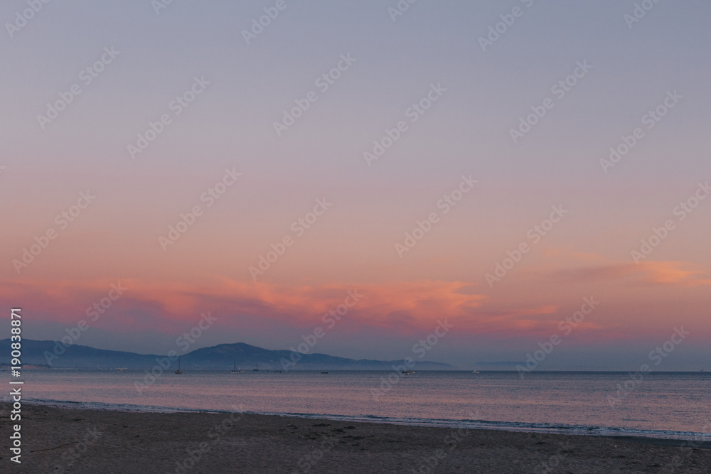 Beautiful Sunset at the Beach in Santa Barbara with Clouds and Mountains