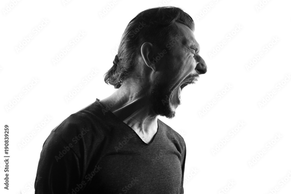 Screaming mle person silhouette,back lit light Screaming mle person silhouette,back lit light