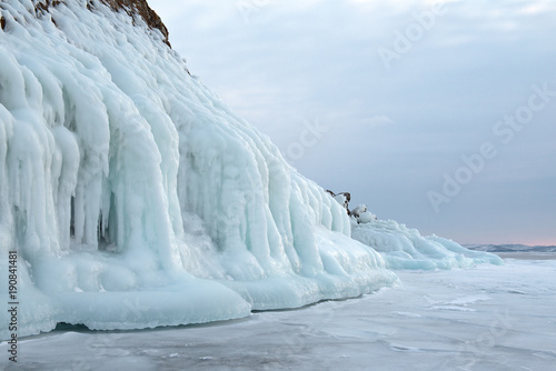 The icy splashes on the rock, winter lake Baikal, cape Hadarta photo