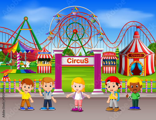 Childrens having fun in amusement park at daytime