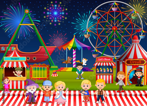 Many Childrens and people worker having fun in amusement park at night