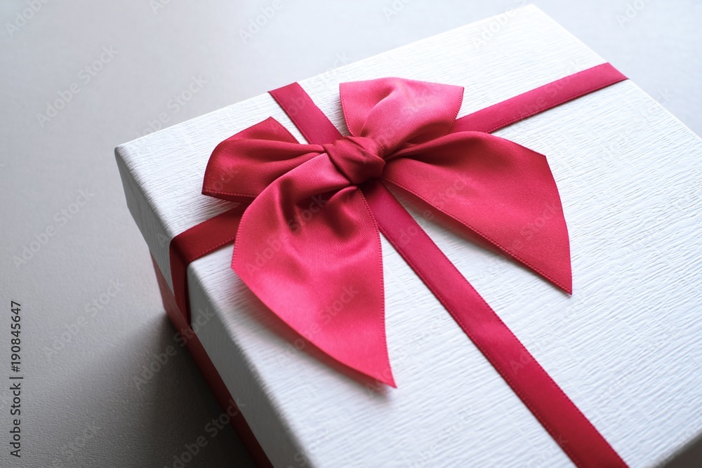 Valentine present. Gift box and red ribbon for romantic couple. Valentine present. Gift box and red ribbon for romantic couple.