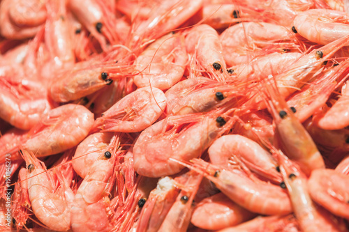 Shrimp lie on the counter in seafood shop