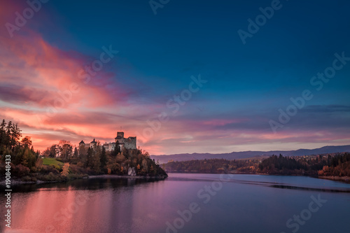 Stunning dusk over castle by the lake, Poland