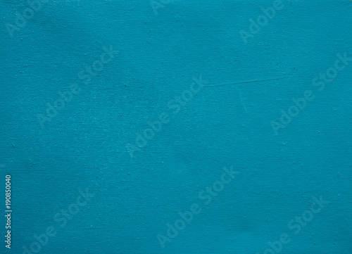 Blue canvas background. Stretched canvas rough texture. Blue teal painted canvas for navy banner template.