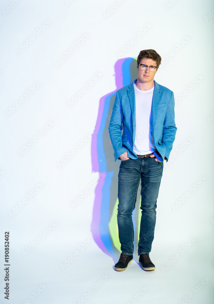 Full length portrait of calm businessman putting hands in pockets. Career concept Full length portrait of calm businessman putting hands in pockets. Career concept
