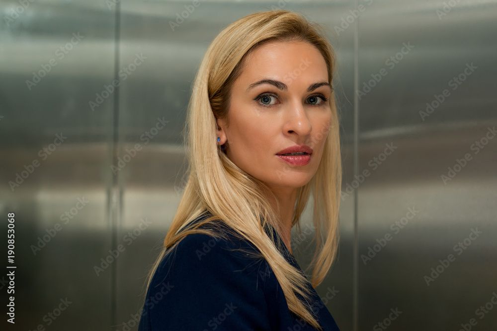 Woman blond in the elevator Woman blond in the elevator