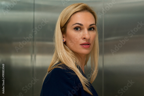 Woman blond in the elevator