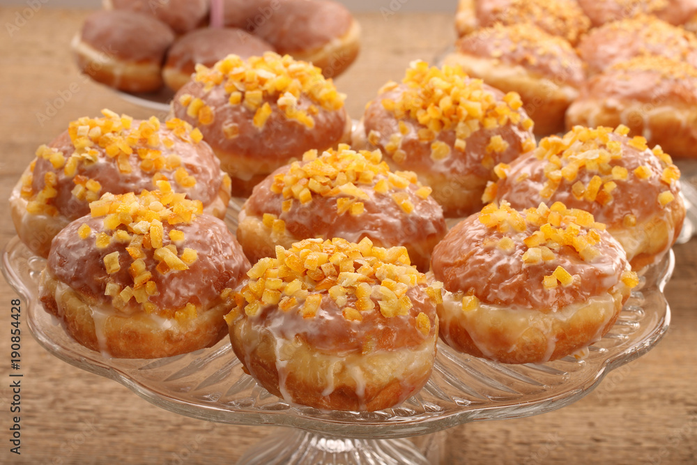 Traditional Polish donuts with filling and orange Traditional Polish donuts with filling and orange