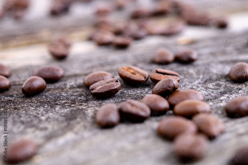 a lot of coffee beans on wooden ground a lot of coffee beans on wooden ground
