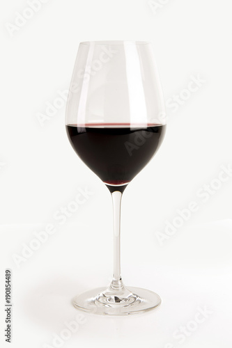 Glass of red wine isolated on white