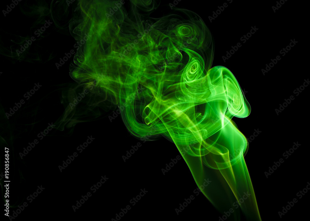 Green smoke on black background Green smoke on black background