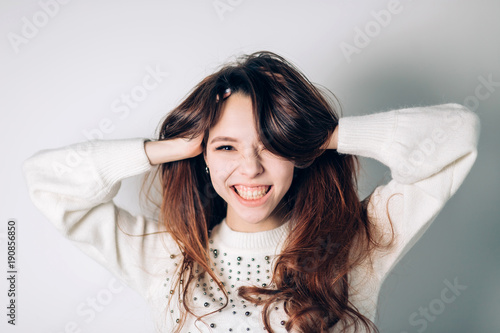 Smiling happy woman. Funny young girl on a white background. Sincere positive emotions.