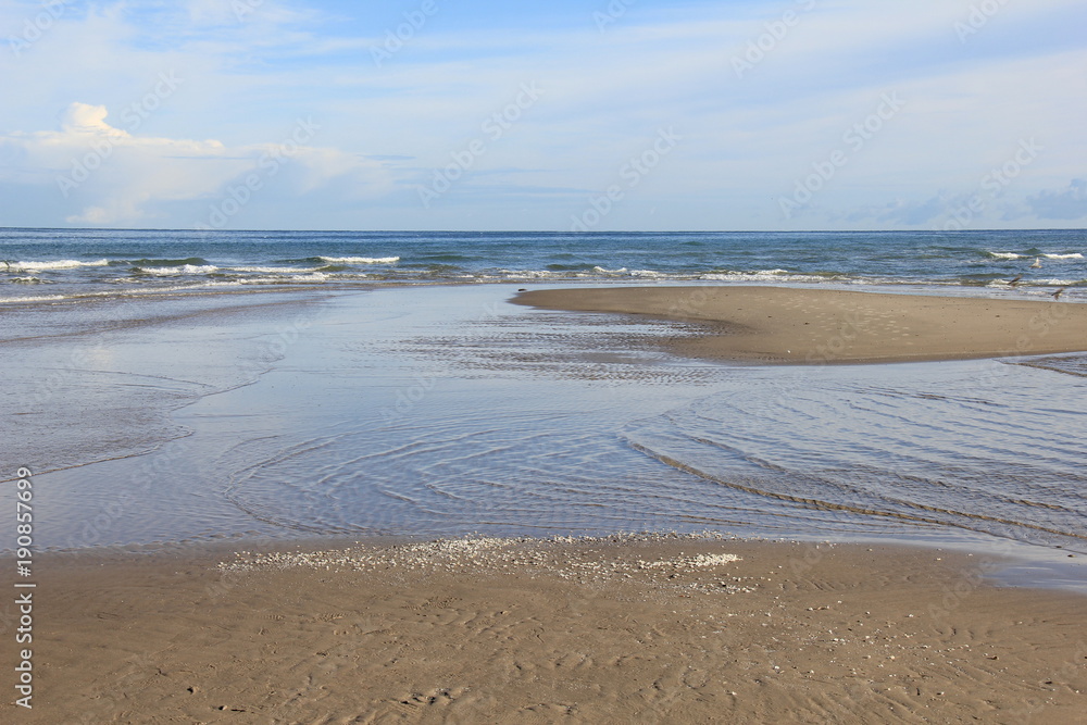 Obraz premium Beach near lighthouse, Skagen Grå Fyr, Denmark. North Sea Coast.