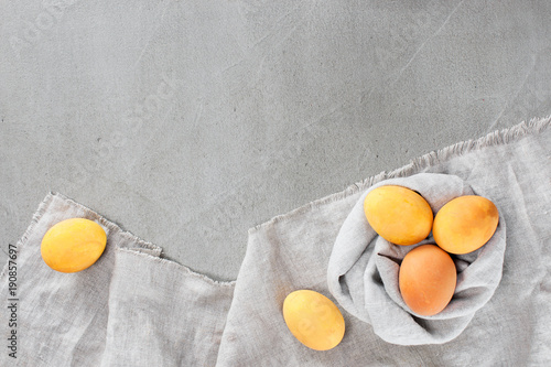 Gray Easter background with yellow bright eggs