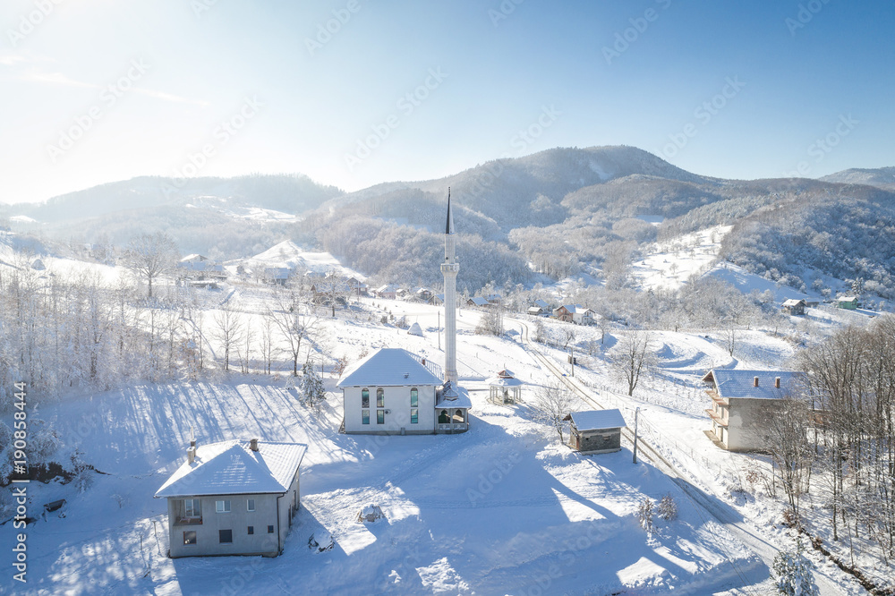 Village during snowy winter season.