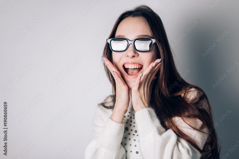 Surprised joyful beautiful woman girl in 3d glasses on white background. virtual reality, cinema, modern technology