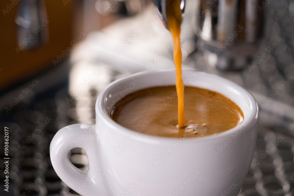 Espresso pour in cup with professional coffee machine Espresso pour in cup with professional coffee machine