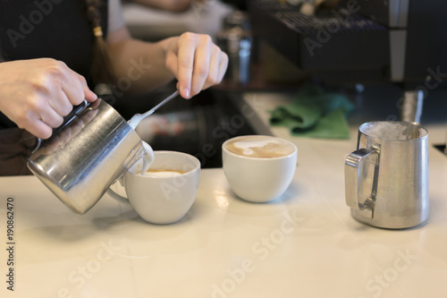 Barista prepares cappuccino