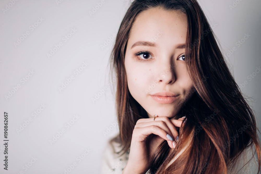 Close up portrait of beautiful young woman on white background. Horizontal, copyspace. Youth and Skin Care Close up portrait of beautiful young woman on white background. Horizontal, copyspace. Youth and Skin Care